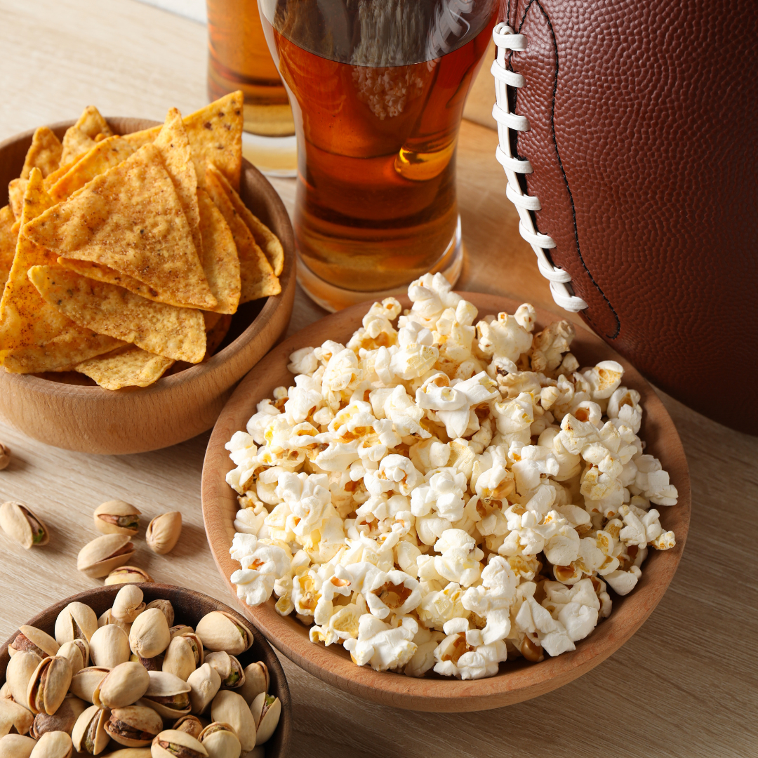 image of popcorn, nuts, and chips